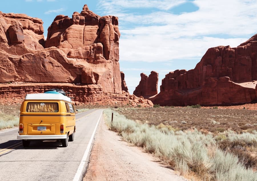 Travelers on a road through open landscape